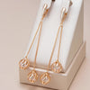 Longues boucles d'oreilles pendantes plaquées or rose 18kt avec pompons et zircon cubique - AC